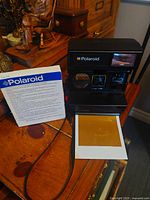 Camera standing with instruction sheet and ejected darkslide