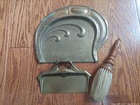 Overview of both brass trays and brush