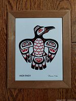 Front view of framed Haida Raven ceramic artwork