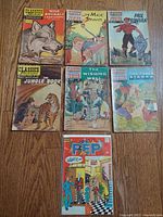 Group shot of all 7 comics