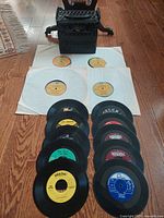 Carry case, four LPs in sleeves, column of 45s