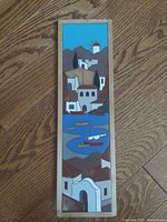 Front view of framed ceramic tile art