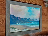 Full view of framed seascape painting