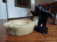 Sculpture and alabaster bowl side by side