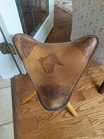 Top view showing tooled leather seat with horse motif