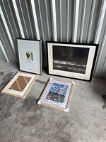 Four frames including Ansel Adams print, Golden Gate Bridge print in Trendsetter frame, empty light wood frame, silver-tone frame