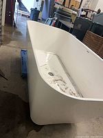 Side view of white freestanding tub