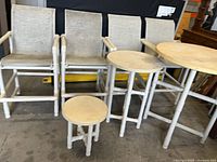 front view of four PVC sling chairs and three round tables