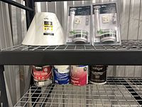 Shelf with lampshade, two flush valve kits, four paint cans
