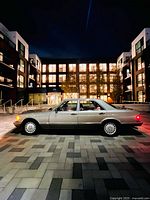 Driver side exterior profile at night showing full vehicle and paint condition