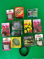 All packaged gardening items laid out on green background