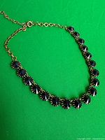 Full view of necklace showing stones and adjustable chain