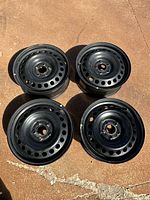 All four black steel rims topside view