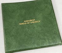 Closed album showing green vinyl cover and gold title