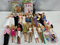 Group shot of all dolls, accessories, fabric bags and pattern