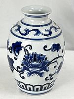 Full view of blue and white porcelain vase with lotus design