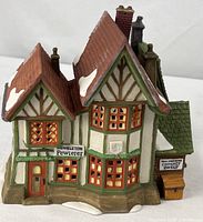 Front view of Dept. 56 Hembleton Pewterer building showing signage and facade details