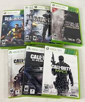 All seven game cases front view