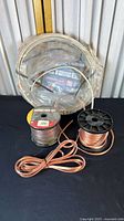 Overall lot showing two wire spools and Romex coil