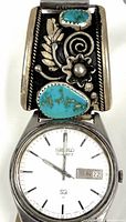 Front view showing watch face and sterling turquoise panel