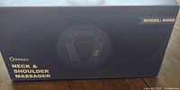 Front of KNQZE neck & shoulder massager box showing model KN68
