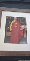 Buddhist monk portrait in brown frame