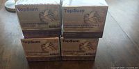 Four sealed TopSum Calming Pheromone refill boxes stacked
