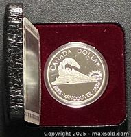 Coin inside red velvet clamshell case