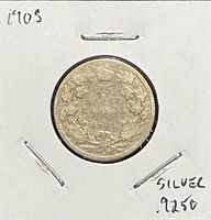 Reverse of 1903 Canadian 25 cents coin in 2x2 holder, crown and maple wreath visible