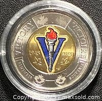 reverse of coloured 2020 WWII commemorative two-dollar coin in capsule