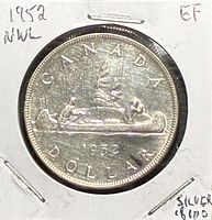 Reverse showing CANADA 1952 dollar canoe design