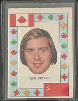 Front of Ken Dryden O-Pee-Chee Player Crest card in protective sleeve