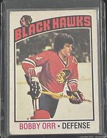 Front of 1976-77 O-Pee-Chee Bobby Orr #213 hockey card in sleeve