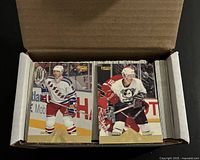 Open box showing front of cards including New York Rangers player card
