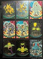 Front view of nine holographic Pokémon Topps cards in sleeve