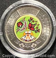 Reverse: colour Indigenous Peoples Day design within two-tone ring