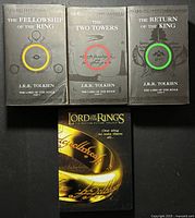 Front covers of three paperback novels and front of DVD case