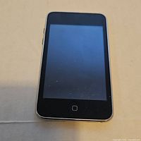 Front view of Apple iPod touch showing black touchscreen and home button