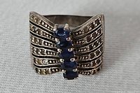 Front view showing blue stones and marcasite details