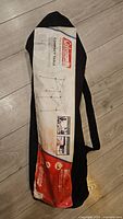 Carry bag with Coleman branding and product sleeve visible