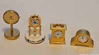 All four miniature clocks side-by-side