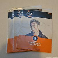 Front view of three sealed Hyde & Eek! zombie tattoo packs