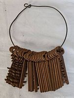 Full view of wire loop holding multiple flat skeleton keys