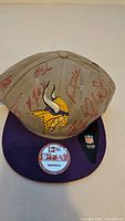 Overall view of signed Vikings snapback hat