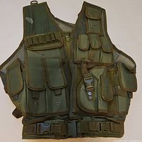 Front view showing zipper, buckle, pockets, mesh construction