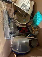Single photo showing all assorted kitchen items in box