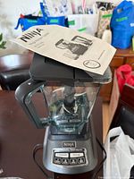 Motor base with blender pitcher and manual