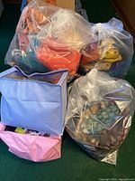 Tote and clear plastic bags filled with textiles