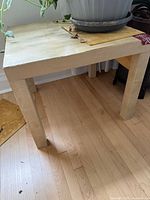 Overall view of square IKEA table with plant on top