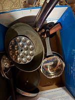 Overview of cookware and utensils inside box
